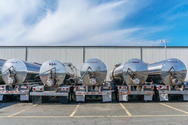 Tanker trucks parked in a line. Oil and gas companies are a good fit for Account-based Marketing.